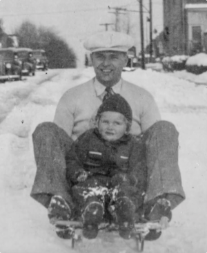 Mildie and Paul sledding when Mildie was a young girl